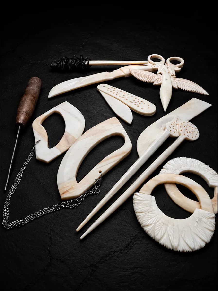 Carved buffalo-bone piece photographed on dark stone (7 of 10)